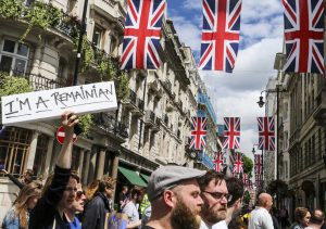 London, UK - July 2, 2016: A group of people protesting the result of the EU Referendum in the UK on on 23 June, which saw the UK vote for Brexit - a withdrawal from the EU. The 'Remainian' is a play on words, referring to Romanians who had been permitted into the UK because of EU laws but who now may be sent back.